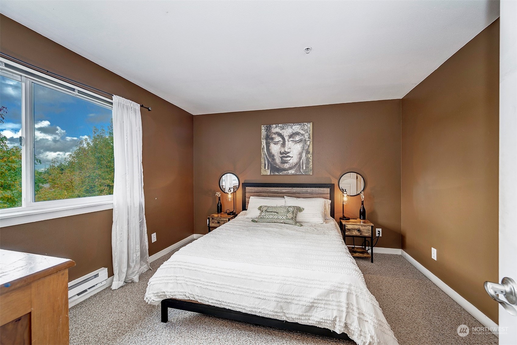3918 243rd Place Southeast, Unit F303 Bothell, WA 98021 - Photo 13 of 23 a bedroom with a bed and wooden floor