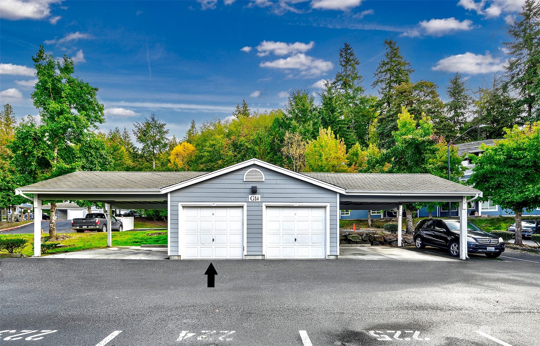 3918 243rd Place Southeast, Unit F303 Bothell, WA 98021 - Photo 18 of 23 a front view of a house with garden