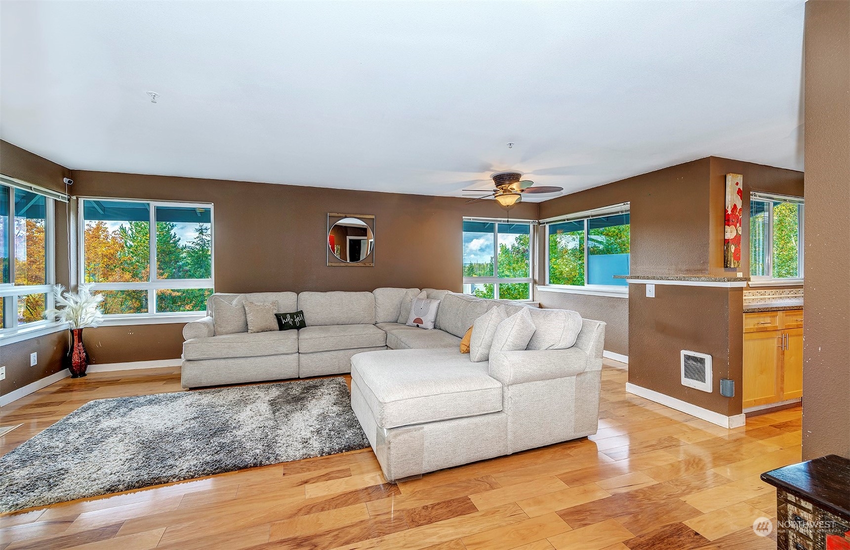 3918 243rd Place Southeast, Unit F303 Bothell, WA 98021 - Photo 4 of 23 a living room with furniture and a large window