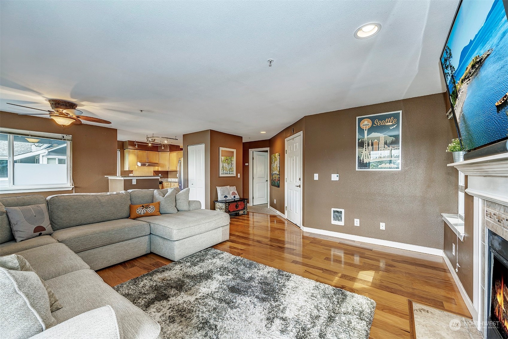 3918 243rd Place Southeast, Unit F303 Bothell, WA 98021 - Photo 7 of 23 a living room with furniture and a rug