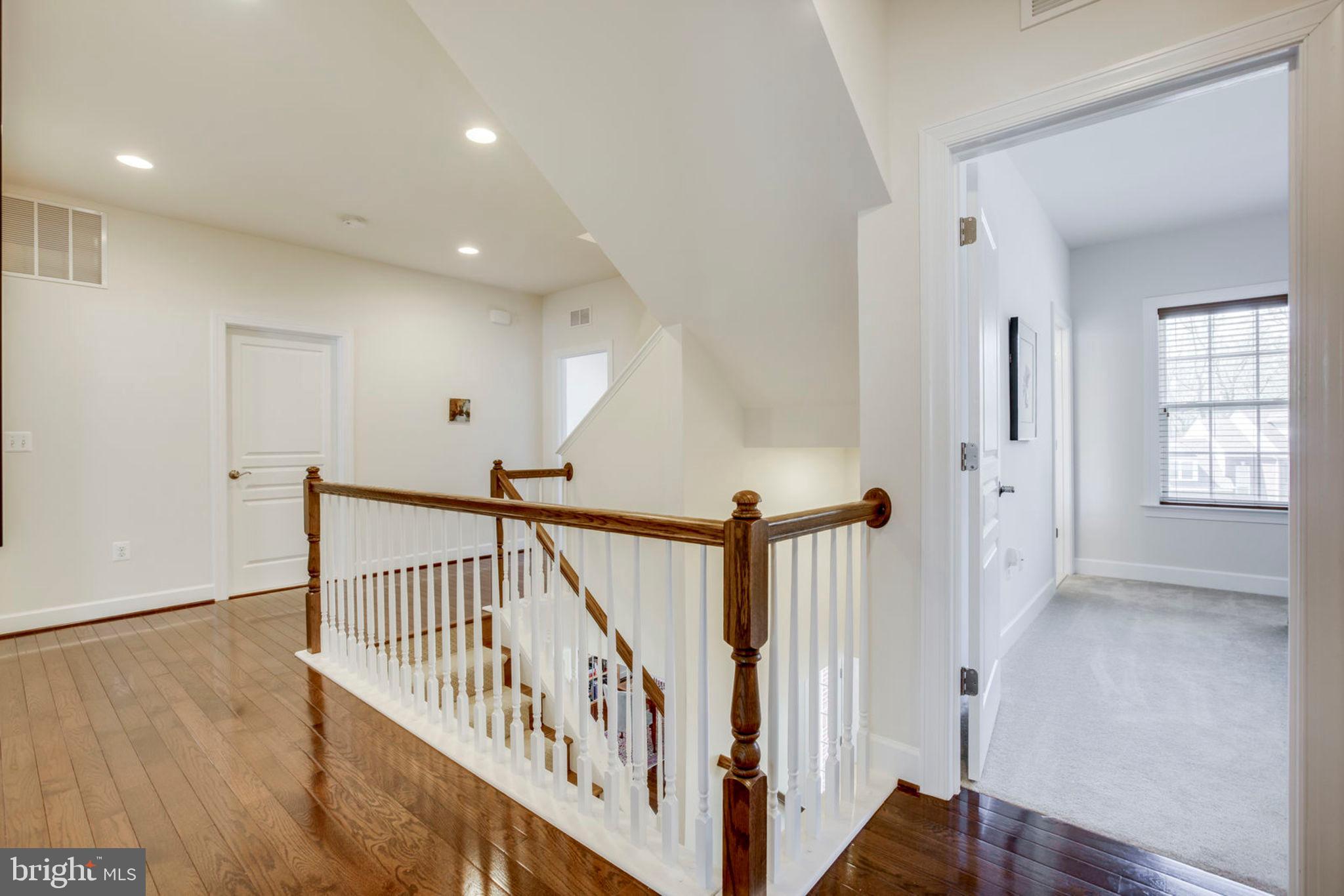 1299 Scotts Run Road McLean, VA 22102 - Photo 15 of 22 a view of a hallway with windows and stairs
