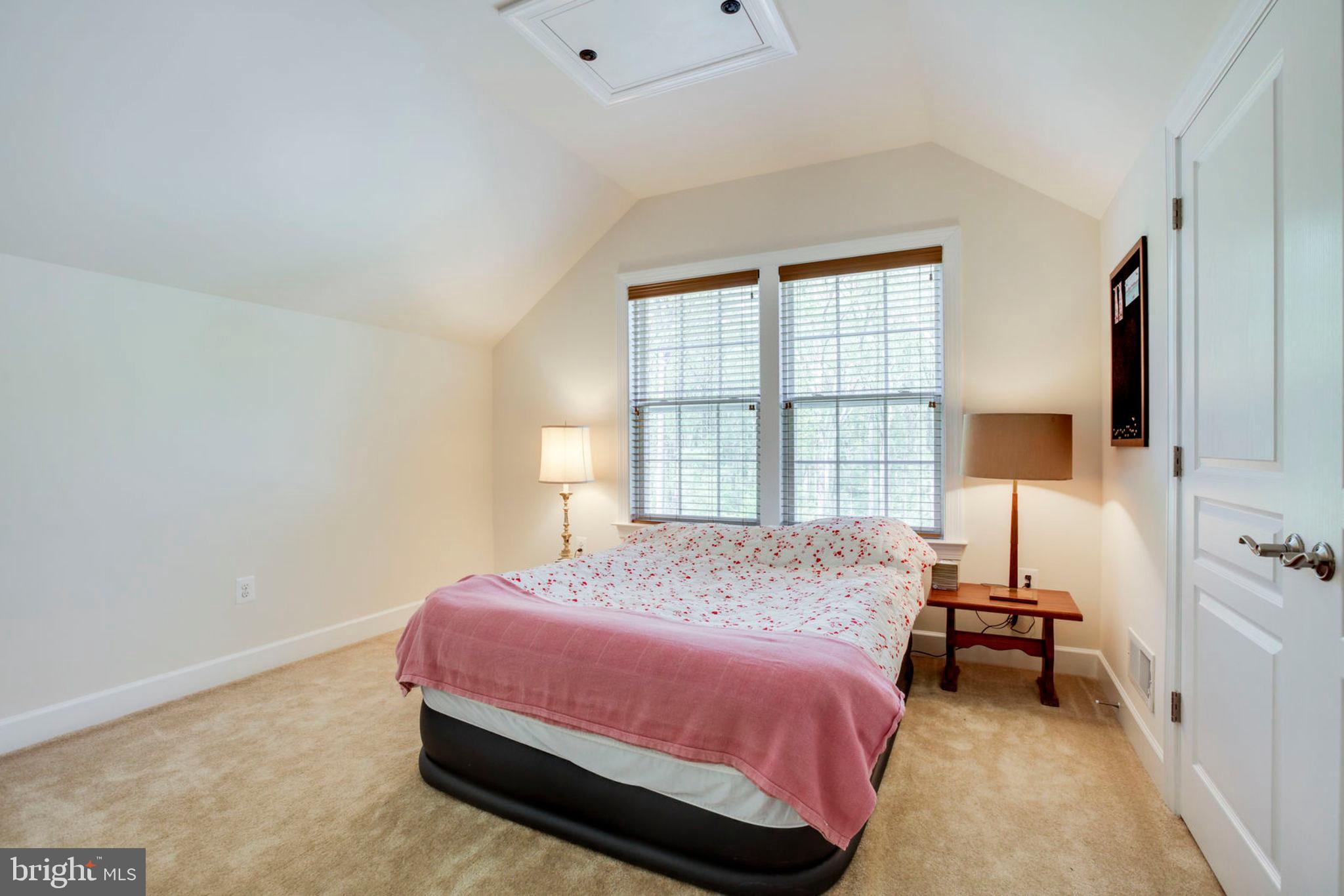 1299 Scotts Run Road McLean, VA 22102 - Photo 16 of 22 a bedroom with a bed and a window