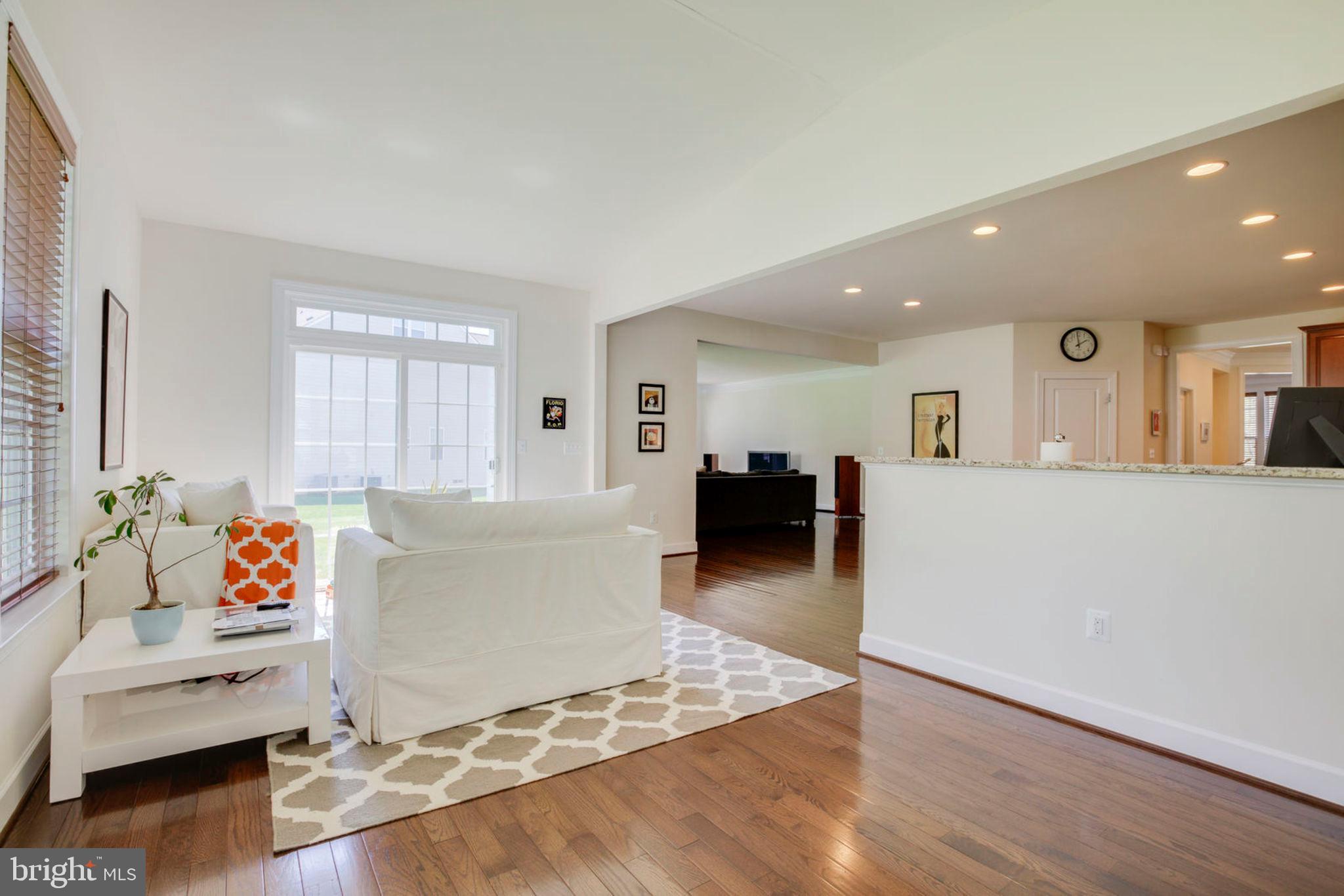 1299 Scotts Run Road McLean, VA 22102 - Photo 4 of 22 a living room with furniture and a wooden floor