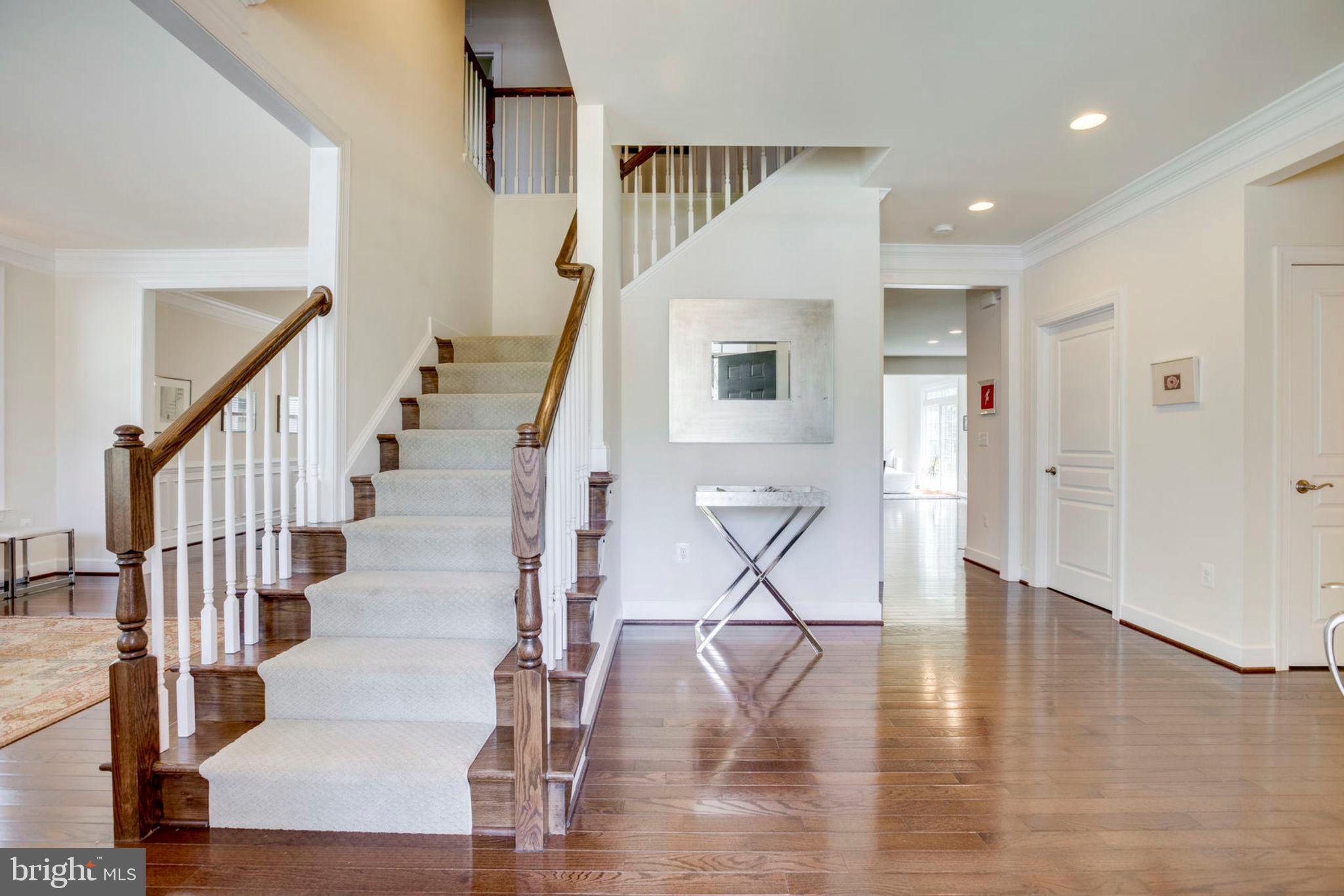 1299 Scotts Run Road McLean, VA 22102 - Photo 7 of 22 a view of entryway and hall with wooden floor