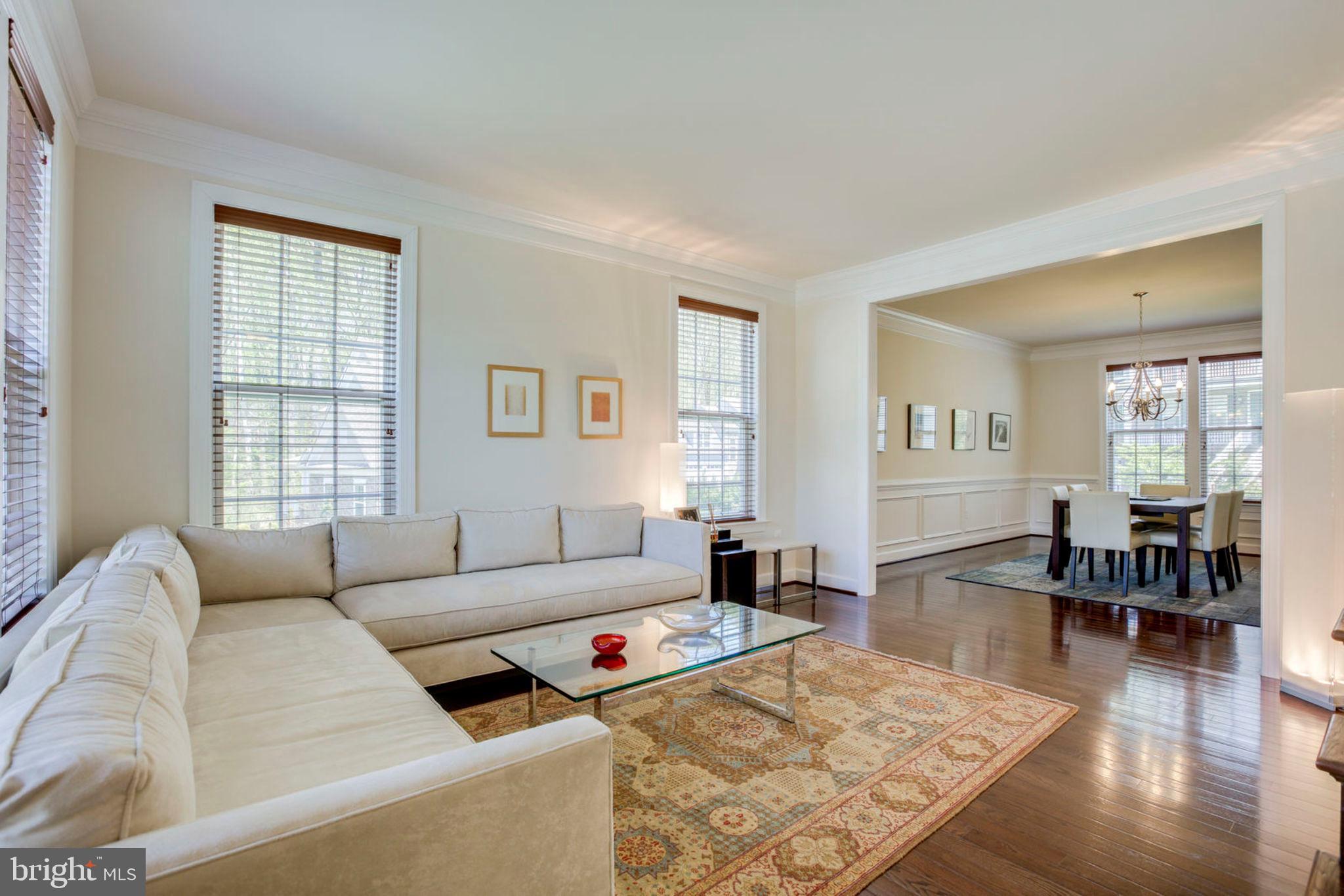 1299 Scotts Run Road McLean, VA 22102 - Photo 9 of 22 a living room with furniture wooden floor and a table