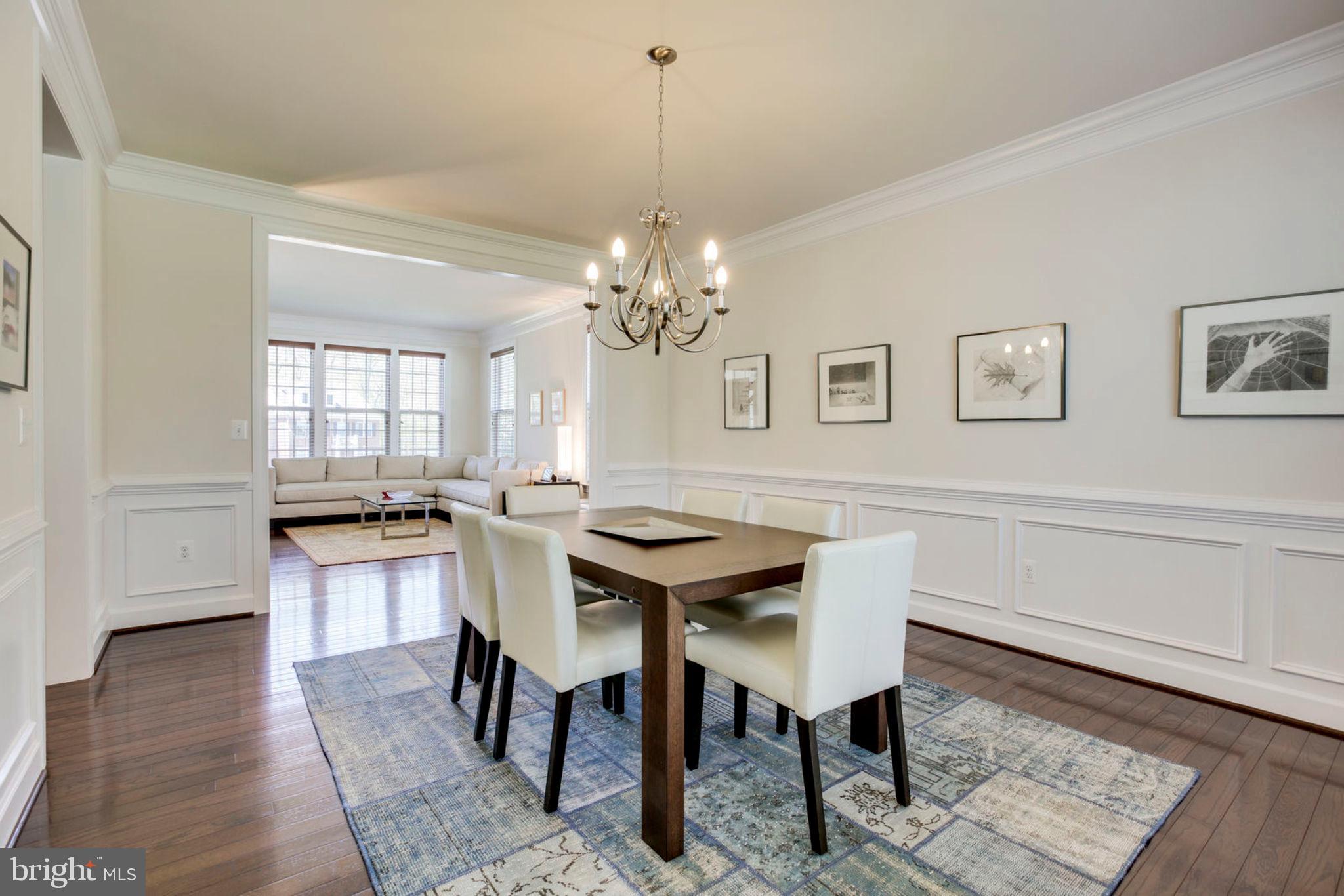 1299 Scotts Run Road McLean, VA 22102 - Photo 10 of 22 a view of a dining room with furniture window and wooden floor