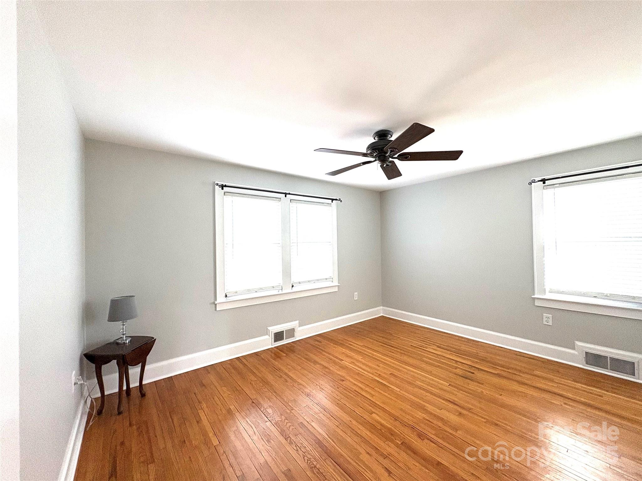 114 Broadway Tryon, NC 28782 - Photo 15 of 41 a view of empty room with wooden floor and fan