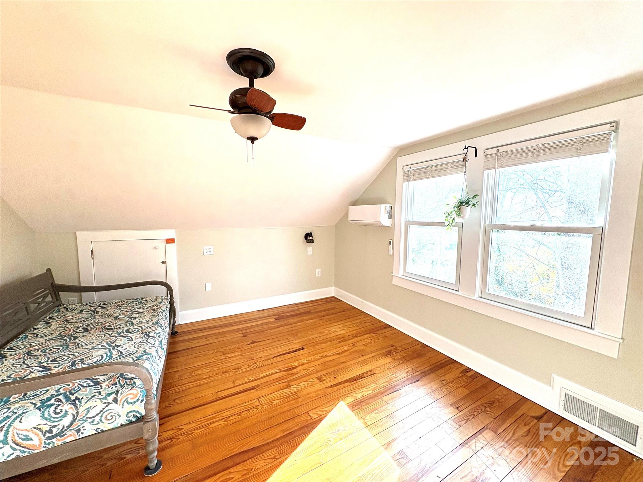 114 Broadway Tryon, NC 28782 - Photo 24 of 41 a view of an empty room with wooden floor and a window
