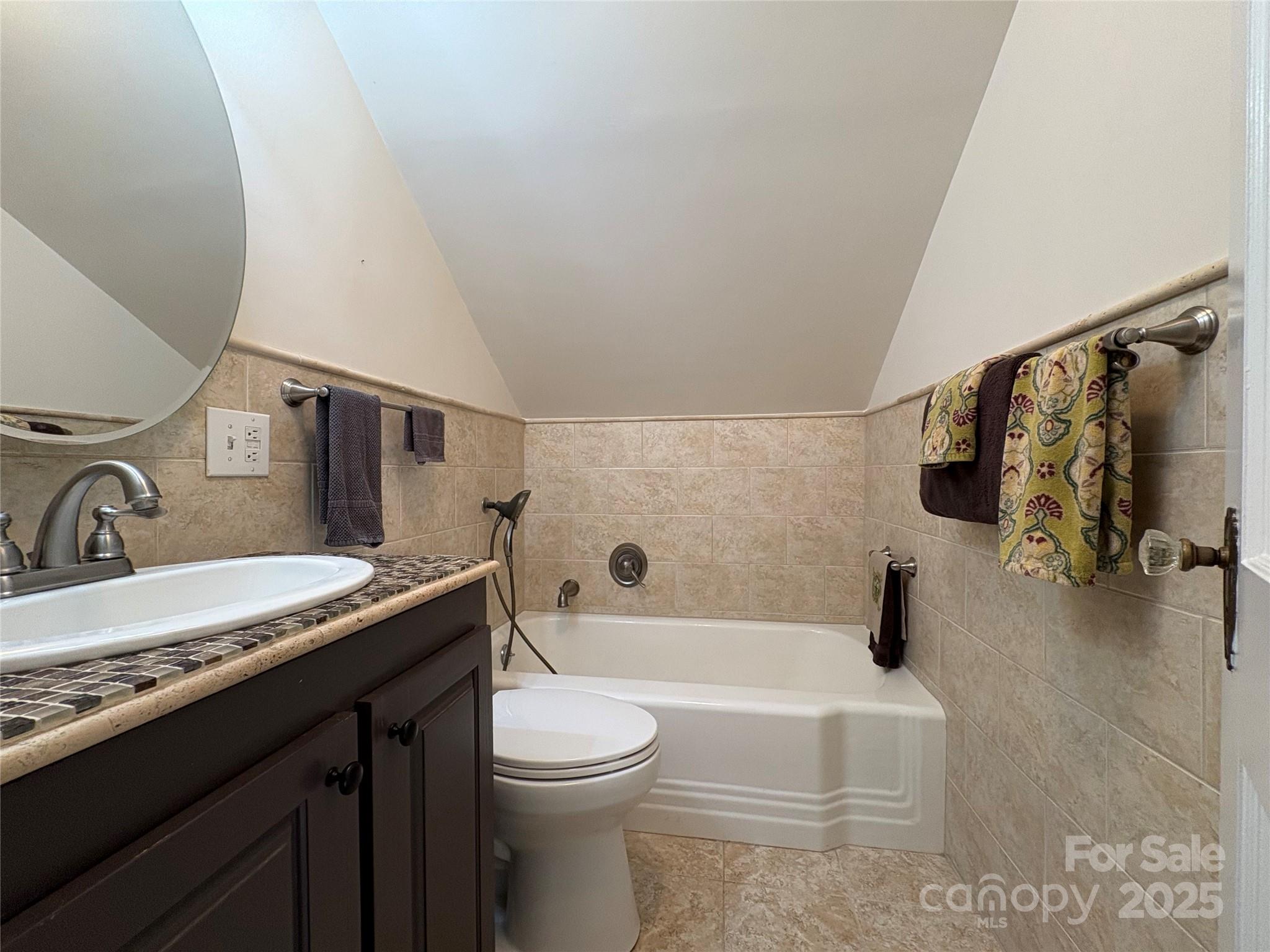 114 Broadway Tryon, NC 28782 - Photo 26 of 41 a bathroom with a granite countertop sink toilet and shower