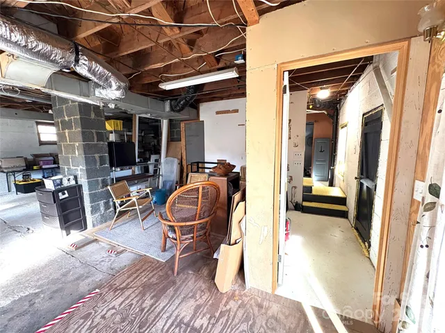 a wooden bench sitting in the middle of a yard