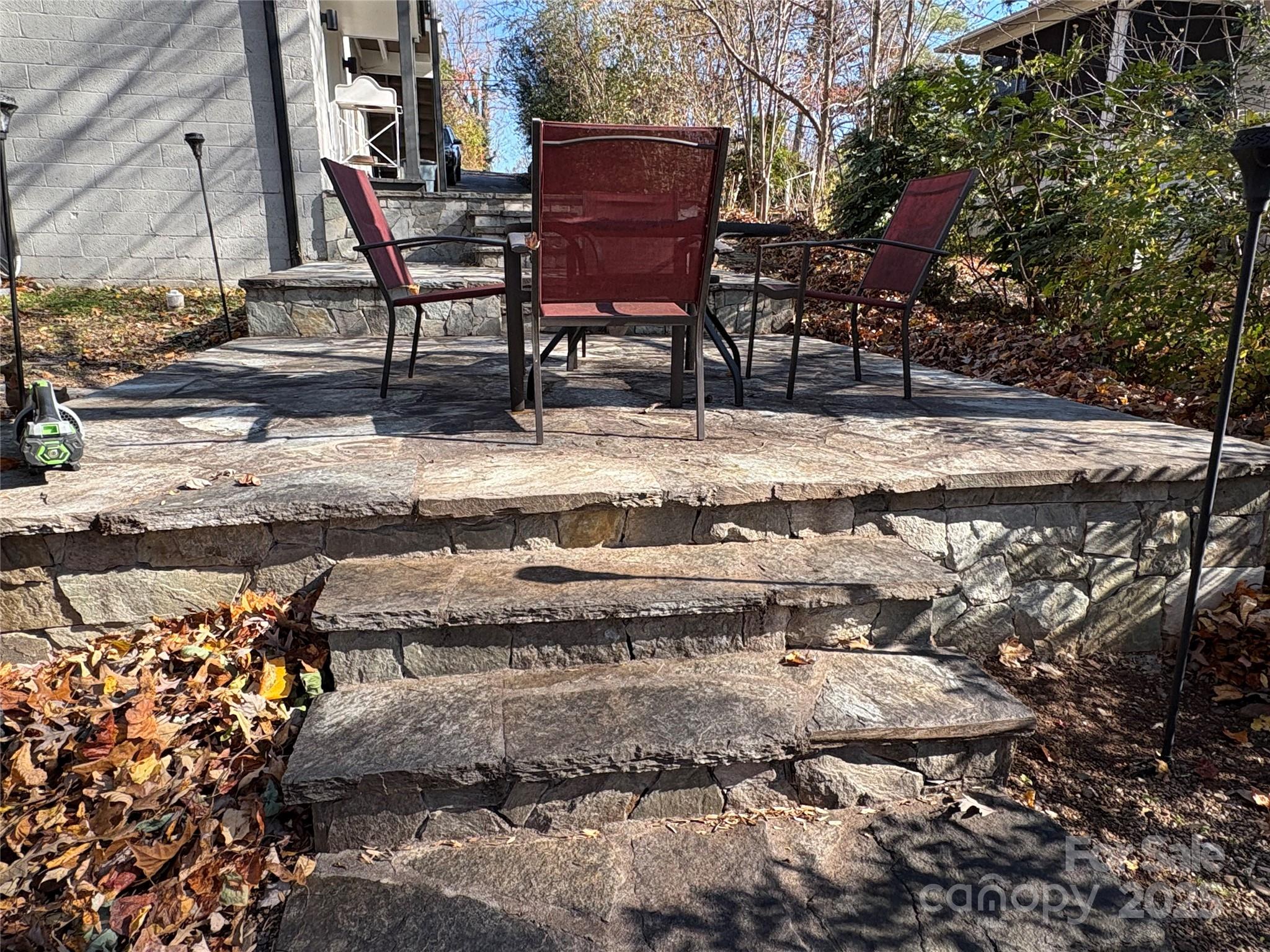 114 Broadway Tryon, NC 28782 - Photo 38 of 41 a wooden bench sitting in the middle of a yard