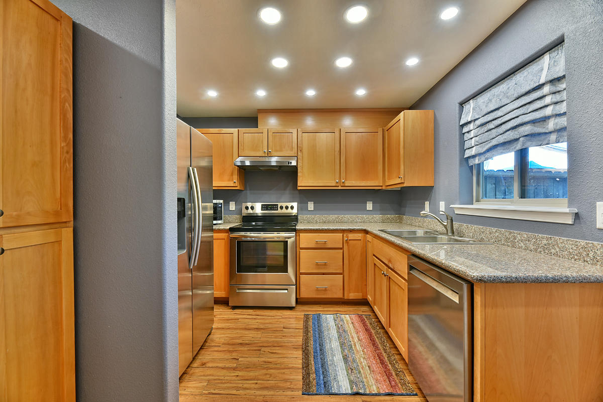450 Midway Road, Unit 39 Medford, OR 97501 - Photo 6 of 21 a kitchen with stainless steel appliances granite countertop a sink and stove top oven