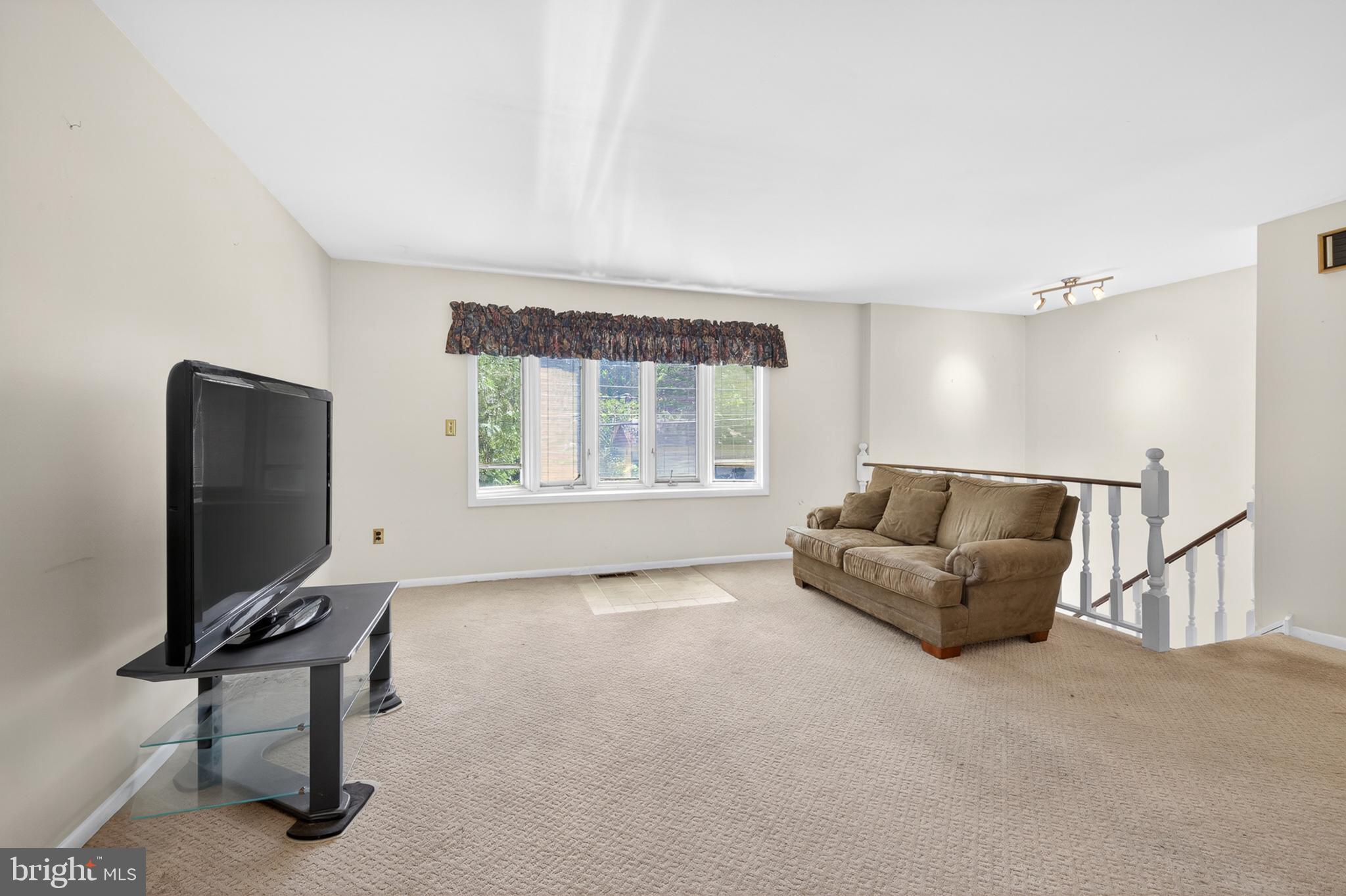 3701 Ebright Road Chadds Ford, PA 19317 - Photo 22 of 45 a living room with furniture and a flat screen tv