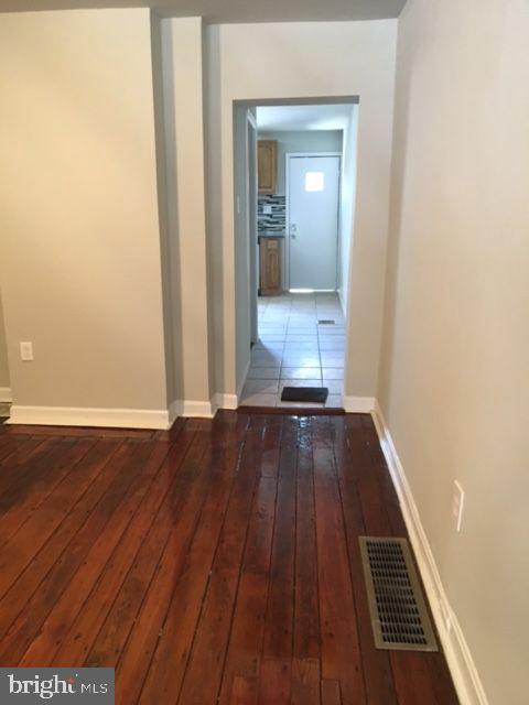 2445 East Huntingdon Street Philadelphia, PA 19125 - Photo 20 of 24 a view of a room with wooden floor and staircase