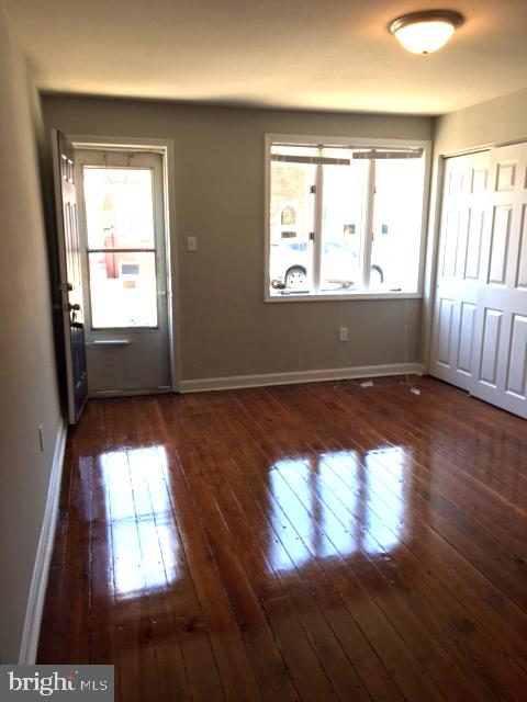 2445 East Huntingdon Street Philadelphia, PA 19125 - Photo 22 of 24 wooden floor in an empty room with a window