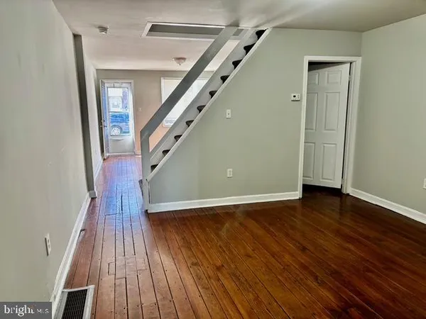 wooden floor in a hall with an entryway