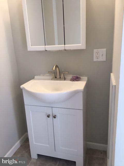 2445 East Huntingdon Street Philadelphia, PA 19125 - Photo 8 of 24 a bathroom with a sink and a vanity
