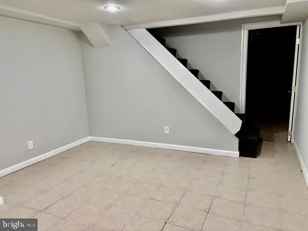 a view of an empty room with windows