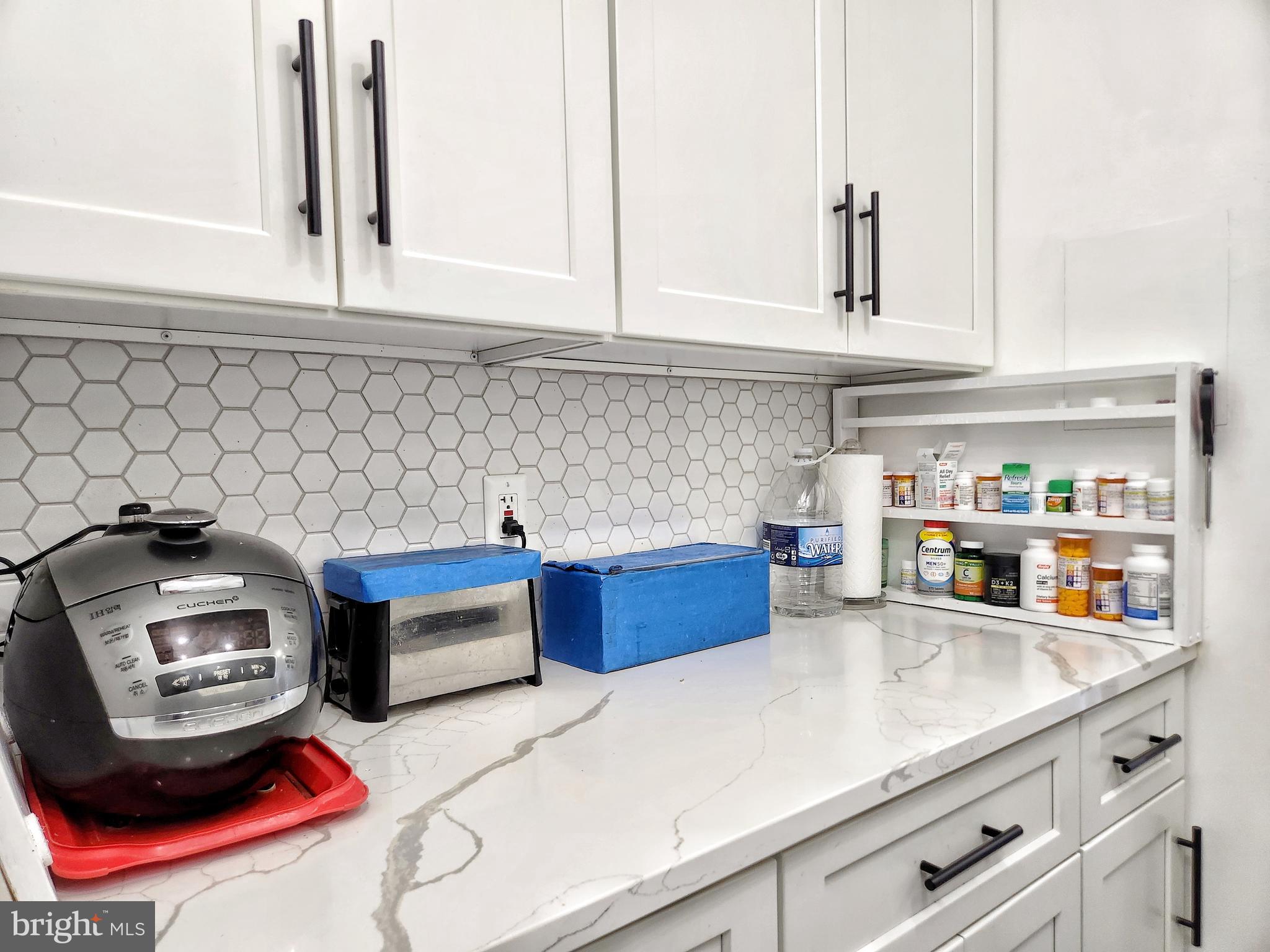 2901 Charing Cross Road, Unit 8 Falls Church, VA 22042 - Photo 17 of 40 a kitchen with stainless steel appliances a sink and cabinets