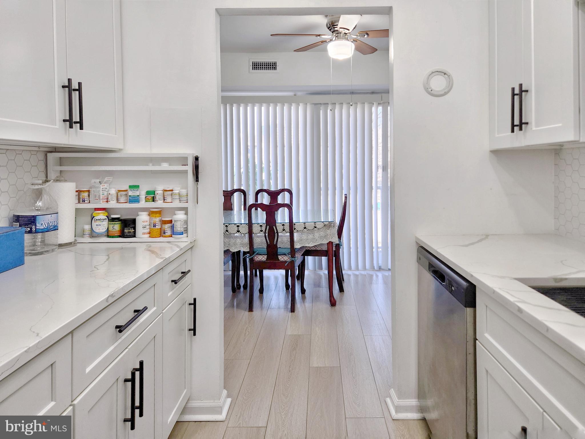 2901 Charing Cross Road, Unit 8 Falls Church, VA 22042 - Photo 18 of 40 a kitchen with granite countertop a sink cabinets and window
