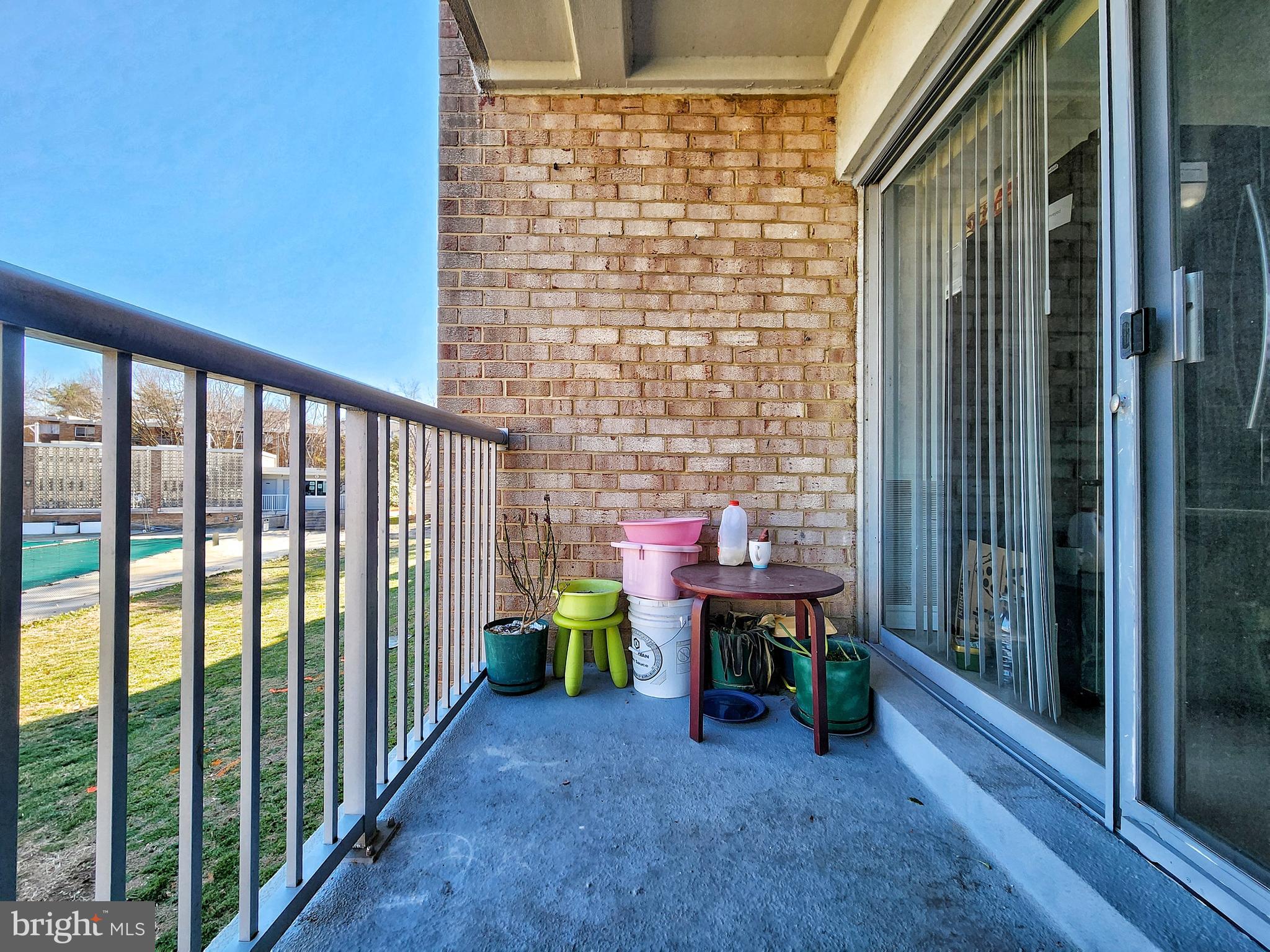 2901 Charing Cross Road, Unit 8 Falls Church, VA 22042 - Photo 29 of 40 a view of a porch with chairs and backyard