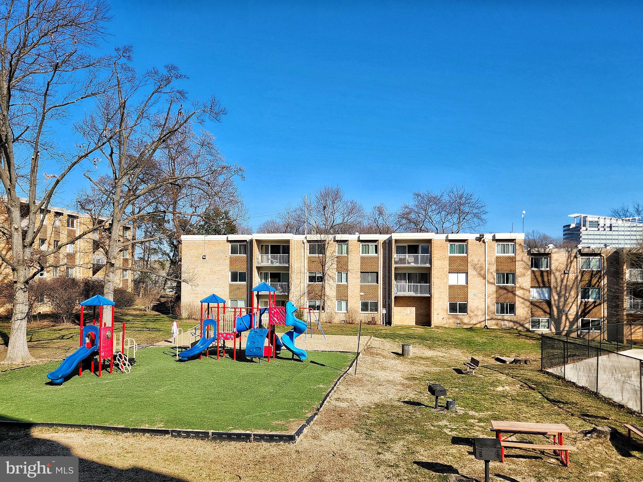 2901 Charing Cross Road, Unit 8 Falls Church, VA 22042 - Photo 32 of 40 a view of a house with a yard
