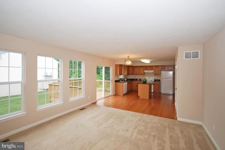 5946 Florey Road Hanover, MD 21076 - Photo 21 of 27 wooden floor in an empty room with a window