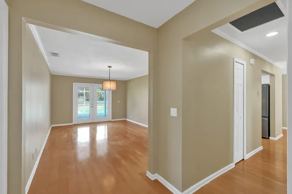 a view of a kitchen with a sink and a window