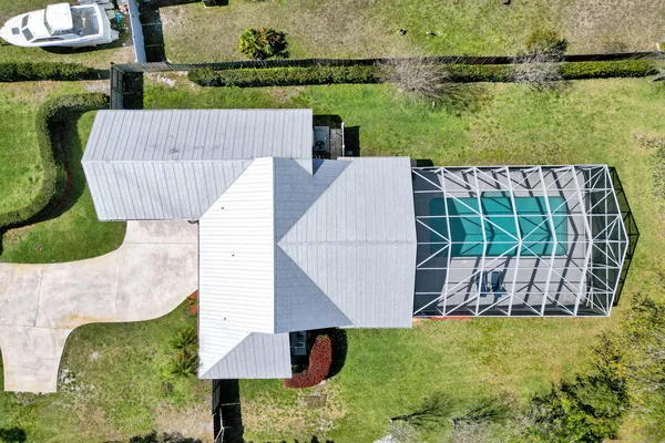 an aerial view of residential houses with outdoor space