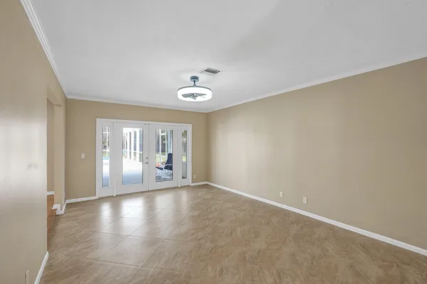 an empty room with a empty space and windows