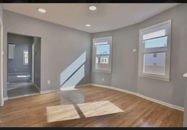 a view of an empty room and window