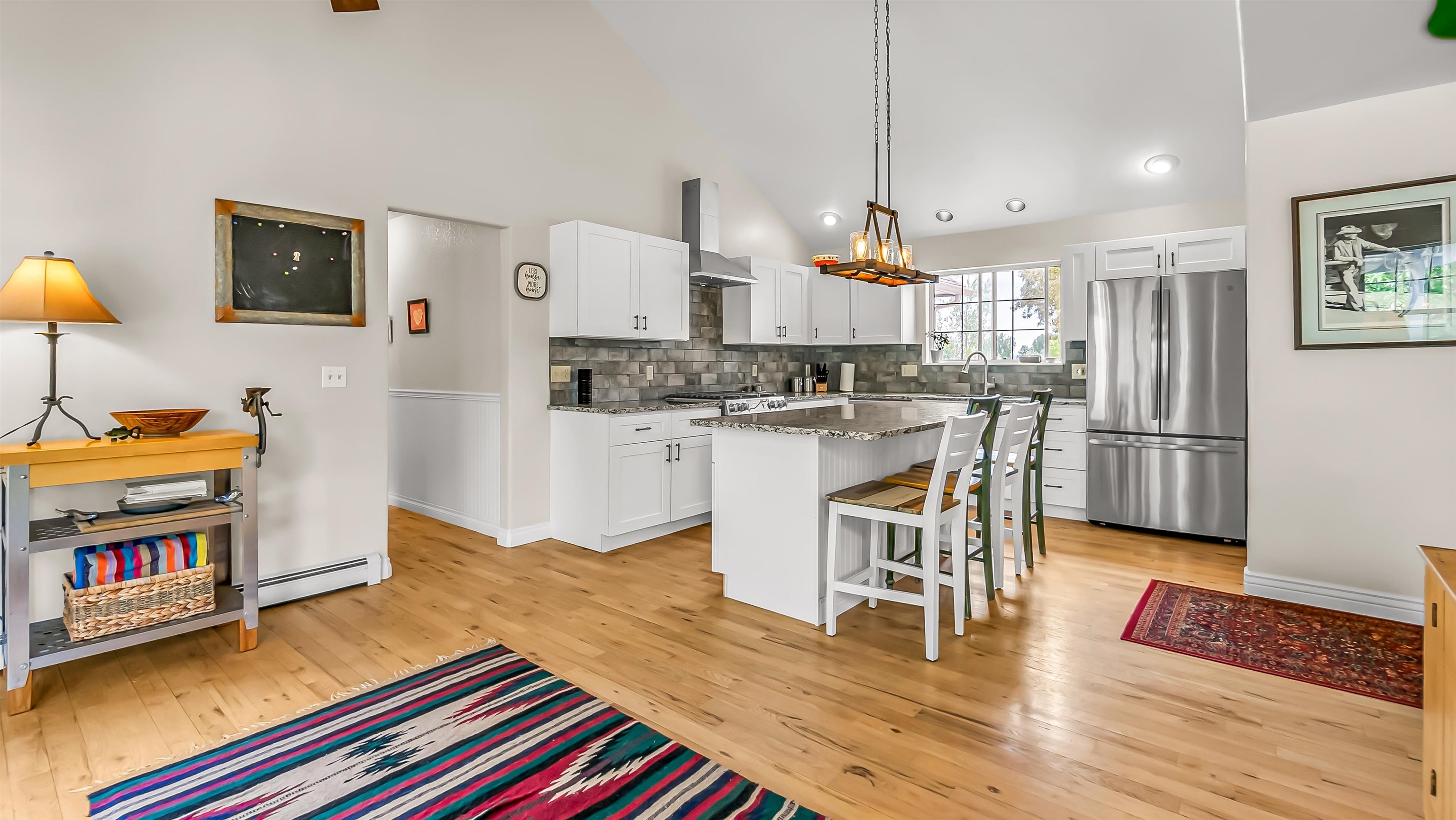 2346 Sundial Road Grand Junction, CO 81505 - Photo 11 of 41 a living room with stainless steel appliances kitchen island granite countertop furniture and a wooden floor
