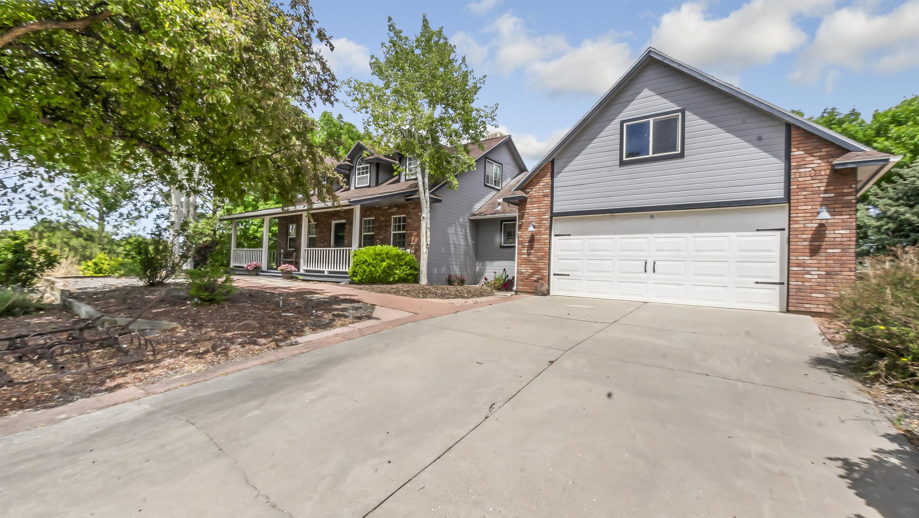 2346 Sundial Road Grand Junction, CO 81505 - Photo 2 of 41 a view of house with a yard and plants