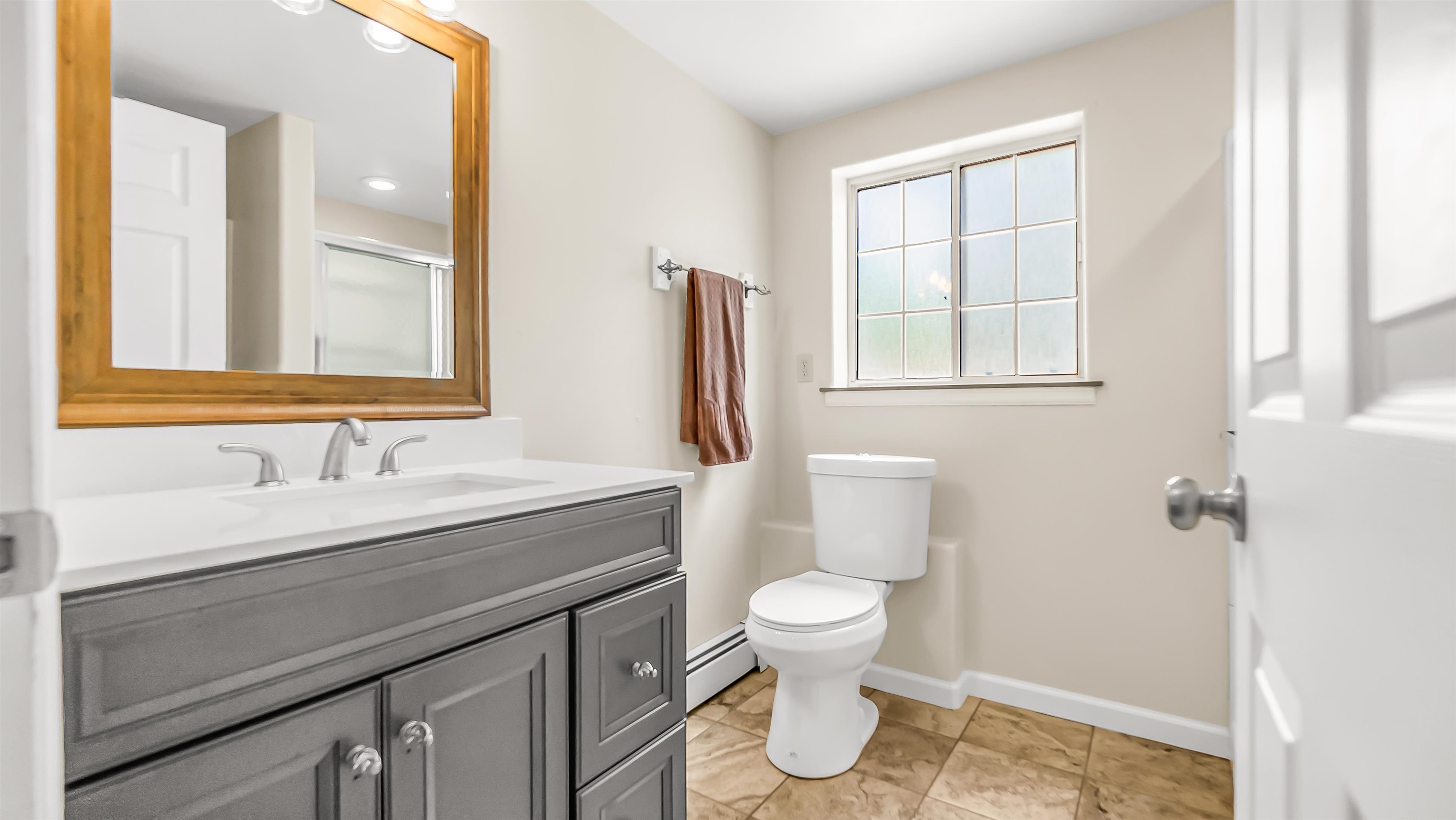 2346 Sundial Road Grand Junction, CO 81505 - Photo 30 of 41 a bathroom with a sink toilet and mirror