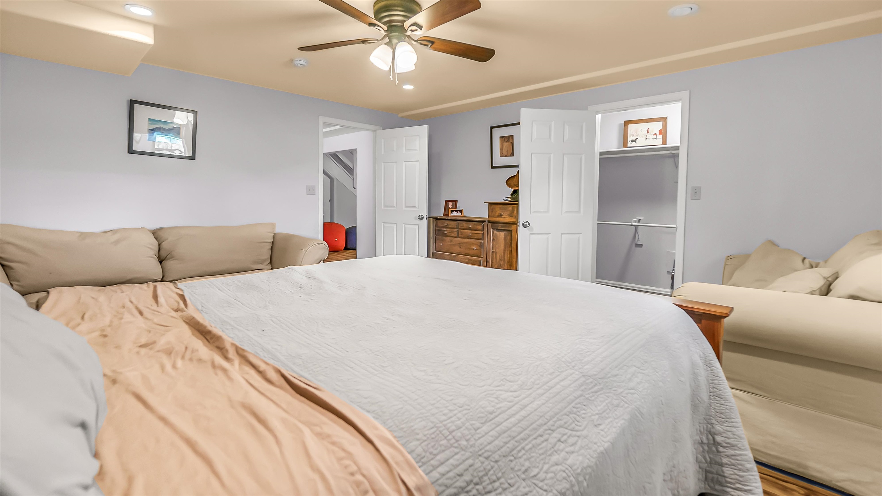 2346 Sundial Road Grand Junction, CO 81505 - Photo 31 of 41 a bed room with a bed and a chandelier