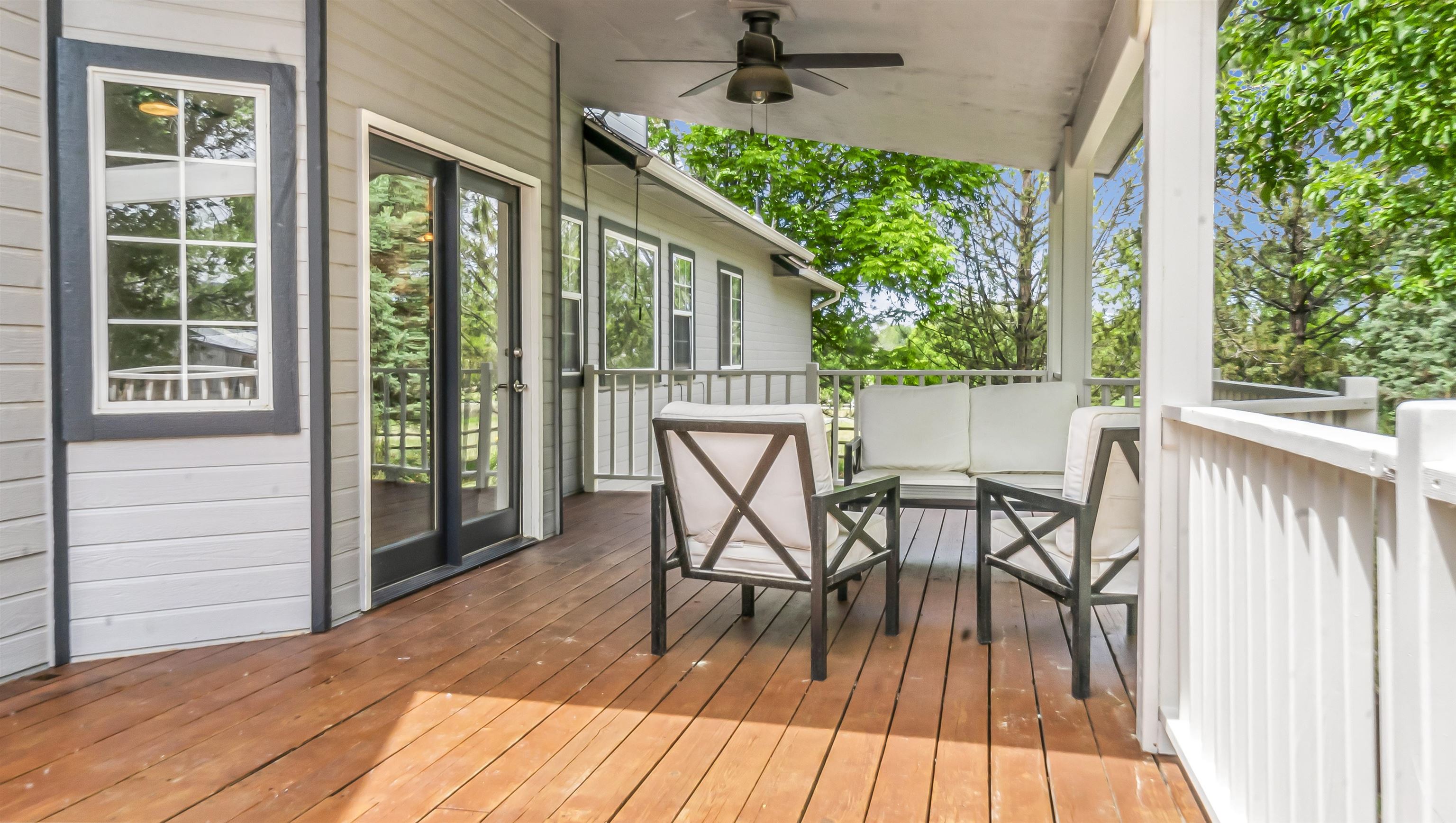 2346 Sundial Road Grand Junction, CO 81505 - Photo 35 of 41 a view of a patio with table and chairs and wooden floor