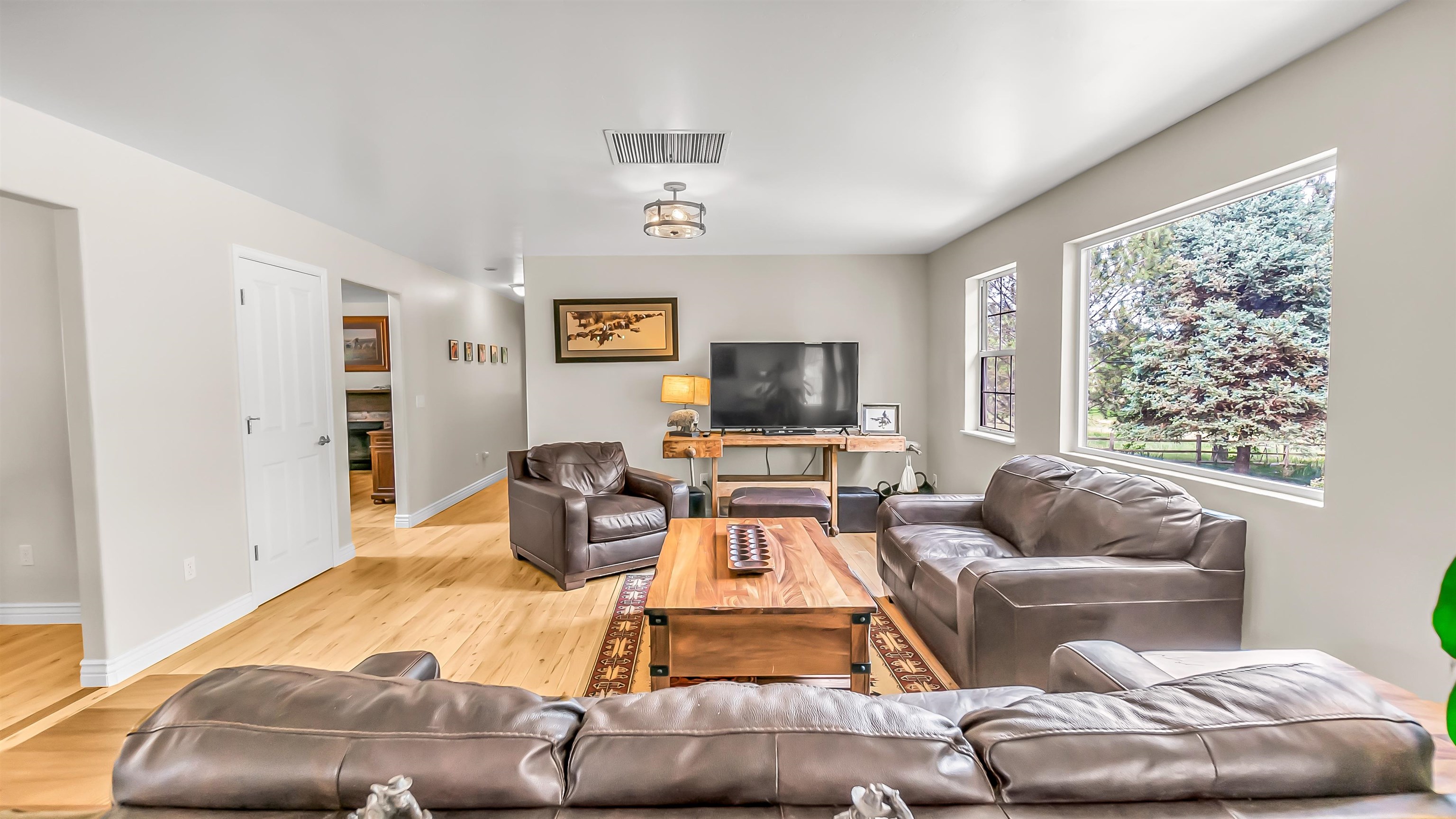 2346 Sundial Road Grand Junction, CO 81505 - Photo 10 of 41 a living room with furniture and a flat screen tv