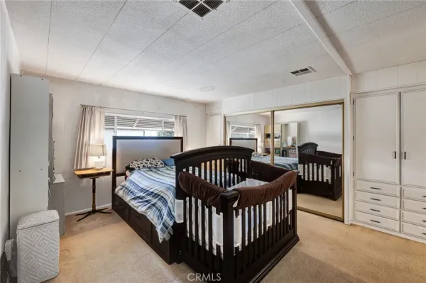 a bedroom with furniture and a window