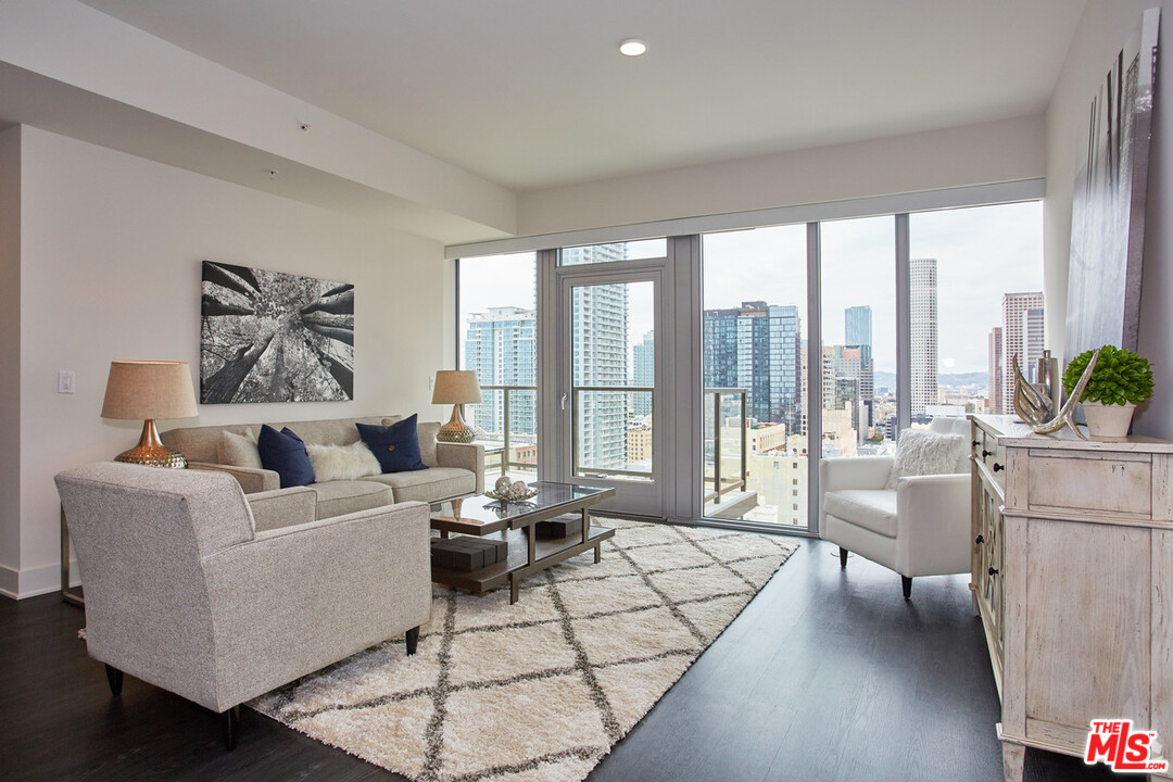 732 South Spring Street, Unit 918 Los Angeles, CA 90014 - Photo 11 of 31 a living room with furniture and large windows