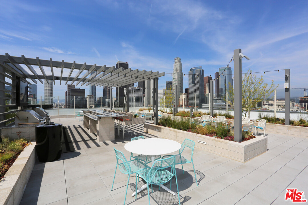 732 South Spring Street, Unit 918 Los Angeles, CA 90014 - Photo 24 of 31 a view of a patio with couches and dining table with chairs