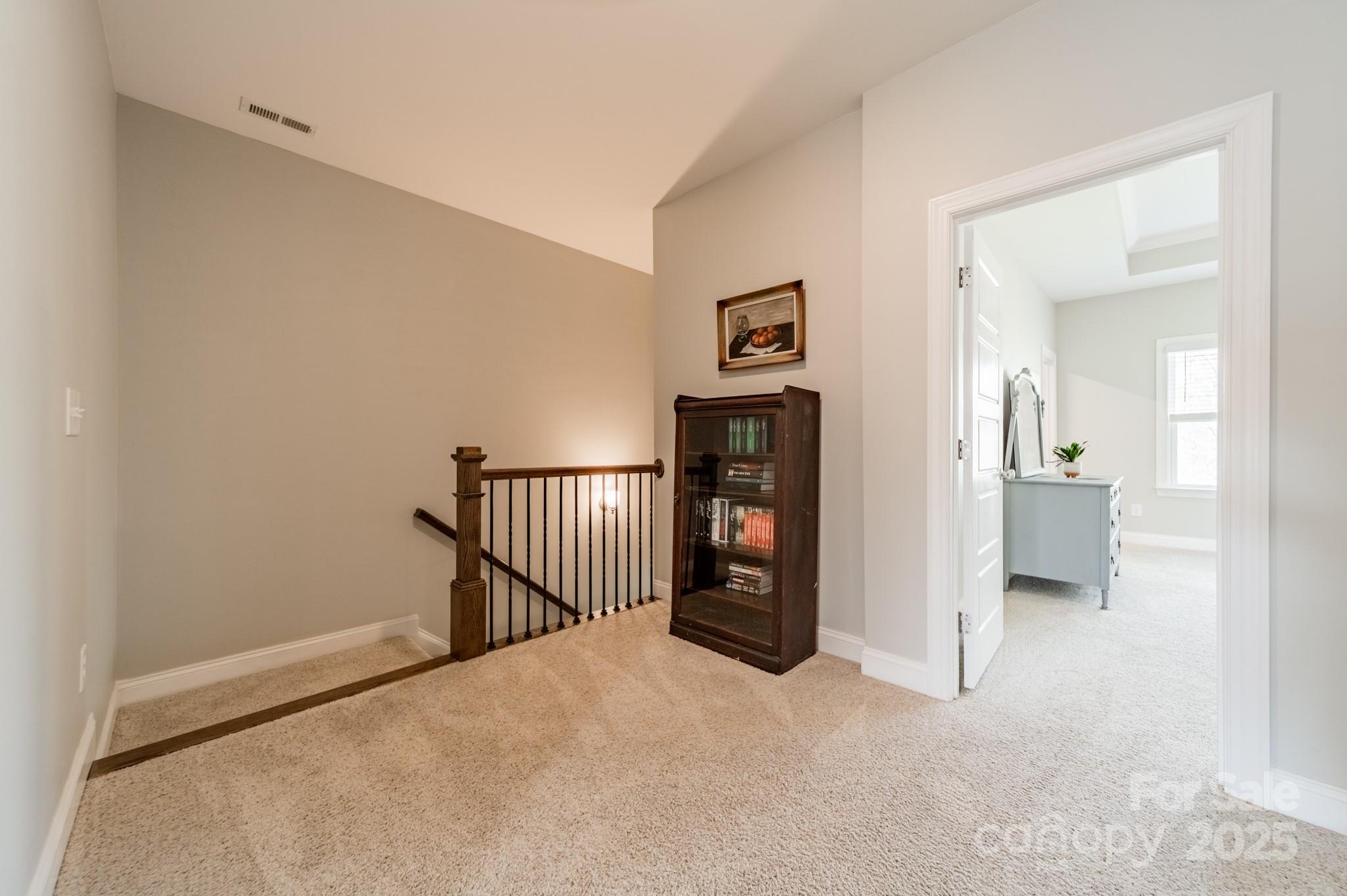 15133 Rocky Bluff Loop Davidson, NC 28036 - Photo 17 of 47 a view of a hallway with a bedroom