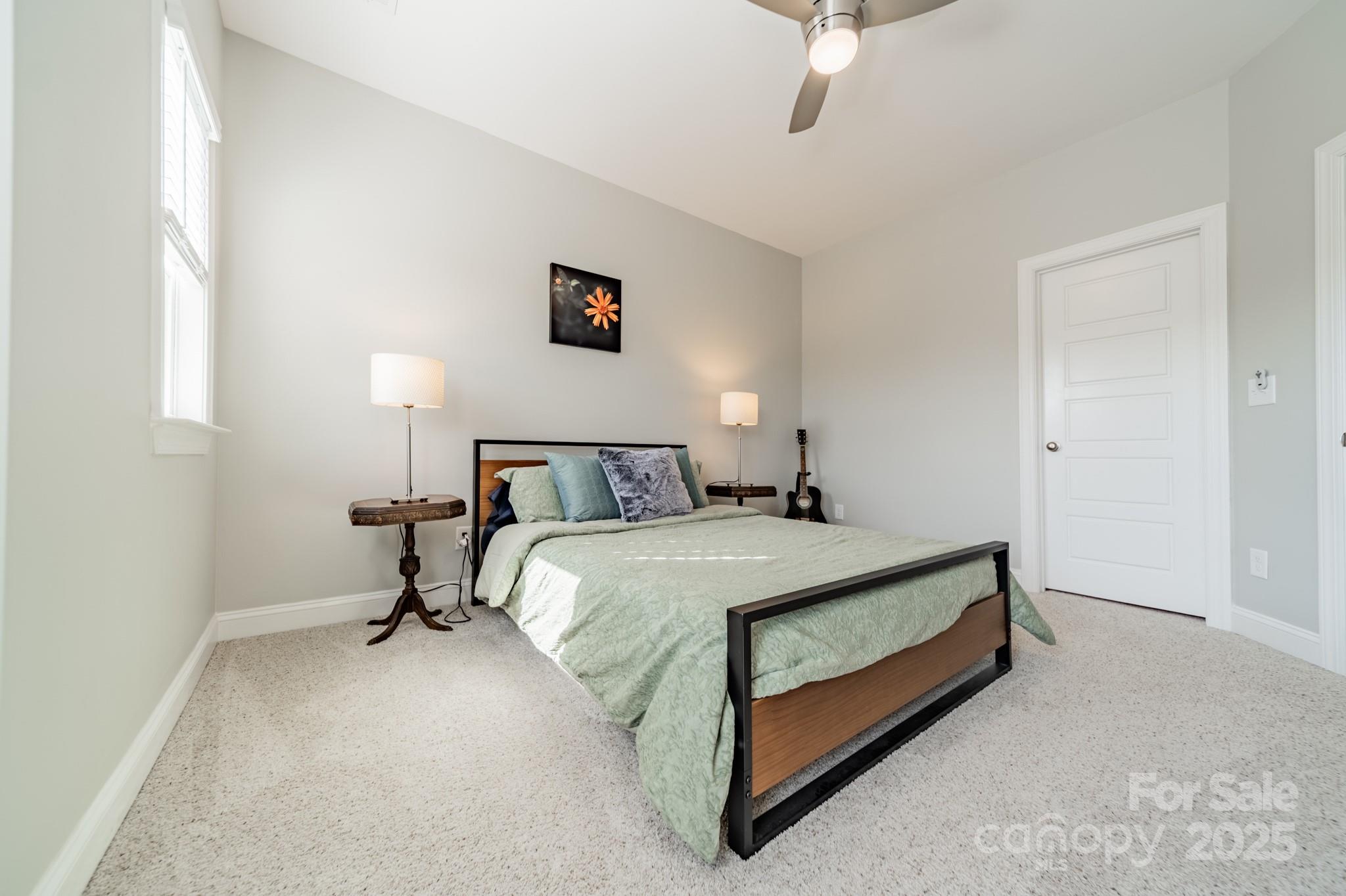 15133 Rocky Bluff Loop Davidson, NC 28036 - Photo 20 of 47 a bed room with a bed and a night stand