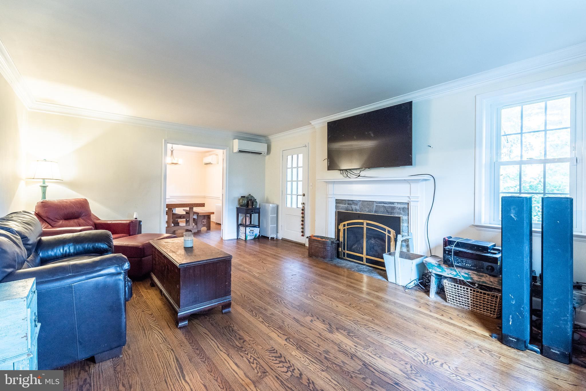 940 Sharpless Road Hockessin, DE 19707 - Photo 9 of 21 Living Room w/ Gas Insert Fireplace & Porch Access
