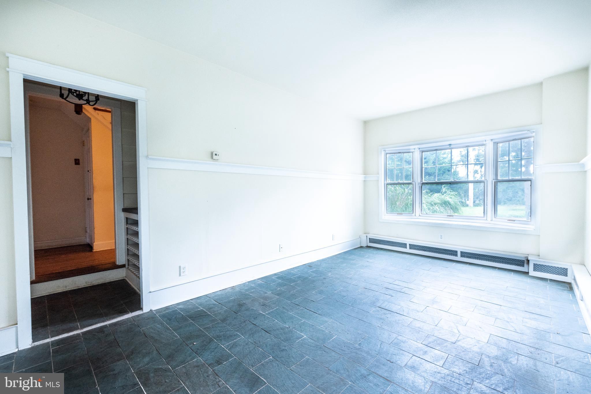 940 Sharpless Road Hockessin, DE 19707 - Photo 10 of 21 Sunroom with Slate Tile Floors