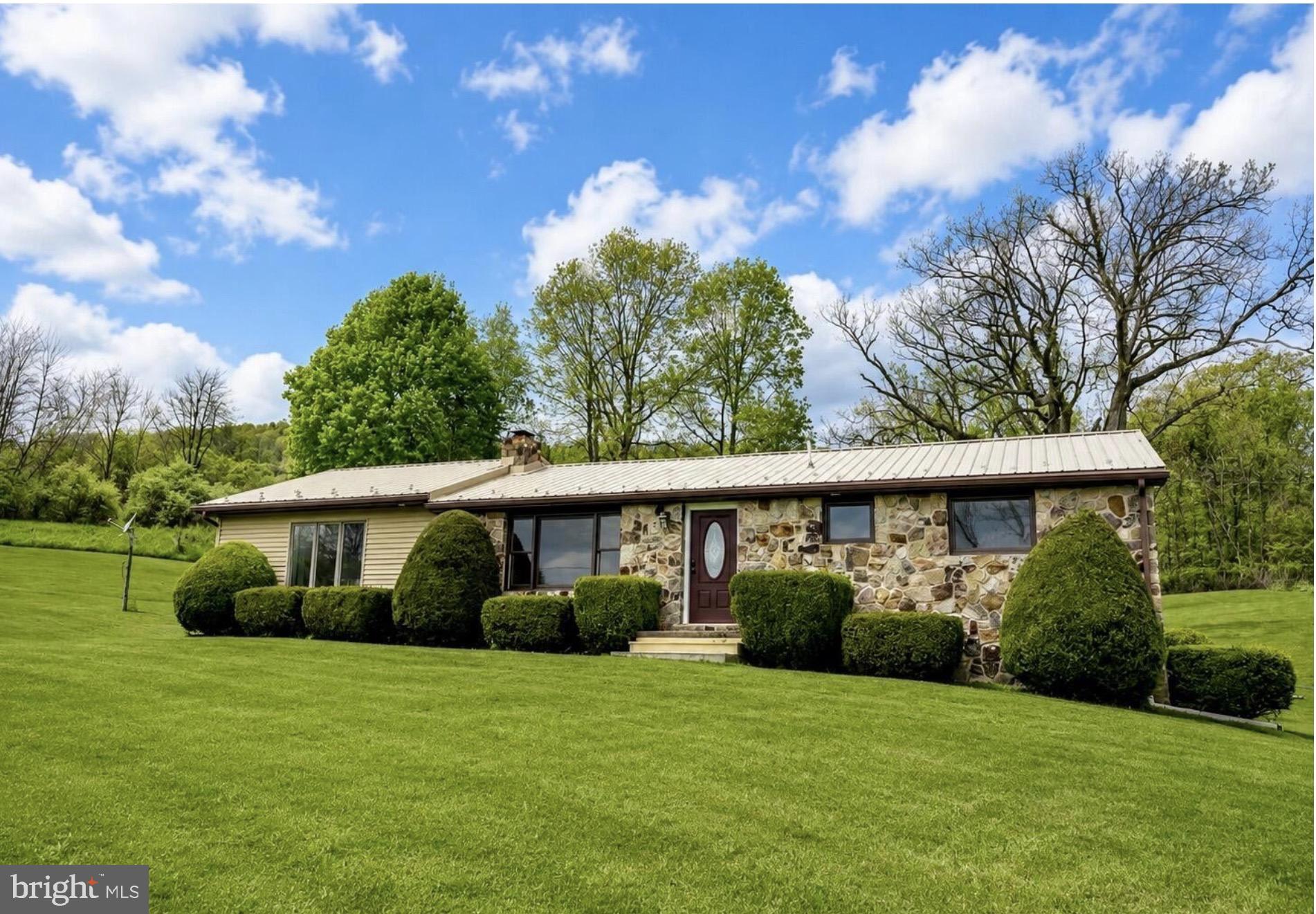 4805 Buffalo Run Road Port Matilda, PA 16870 - Photo 1 of 29 Charming stone home on lush green lawn.