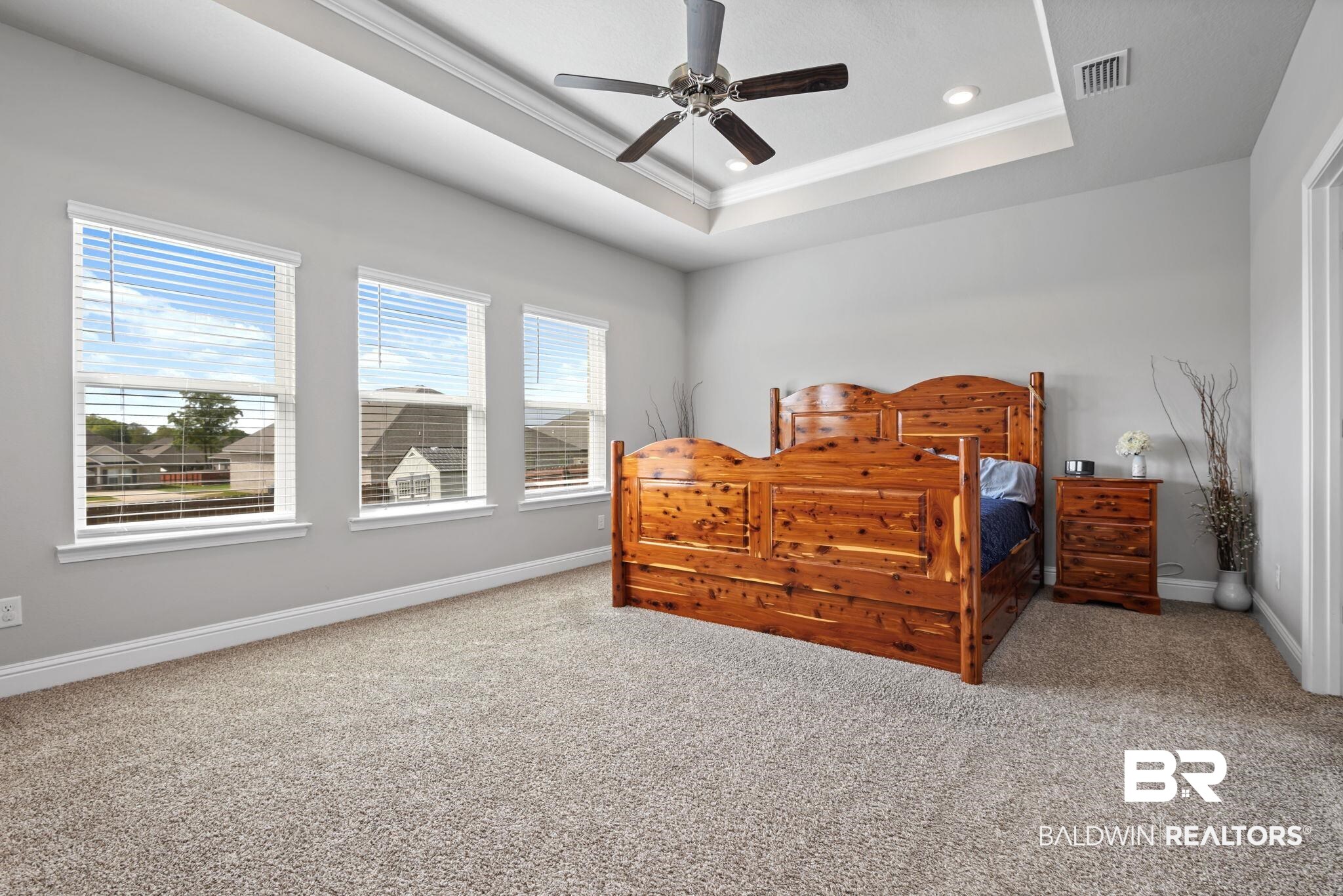 2183 Meadowview Loop Semmes, AL 36575 - Photo 41 of 58 Bedroom featuring crown molding, carpet flooring, and a ceiling fan