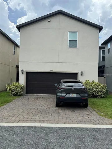 a car parked in front of a house