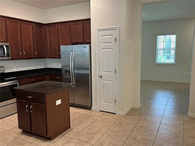 an empty room with cabinets