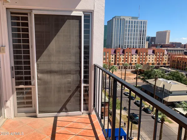 a view of a balcony with sitting area