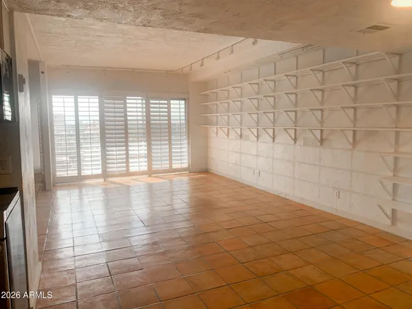 a kitchen with stainless steel appliances granite countertop a stove a refrigerator and a microwave